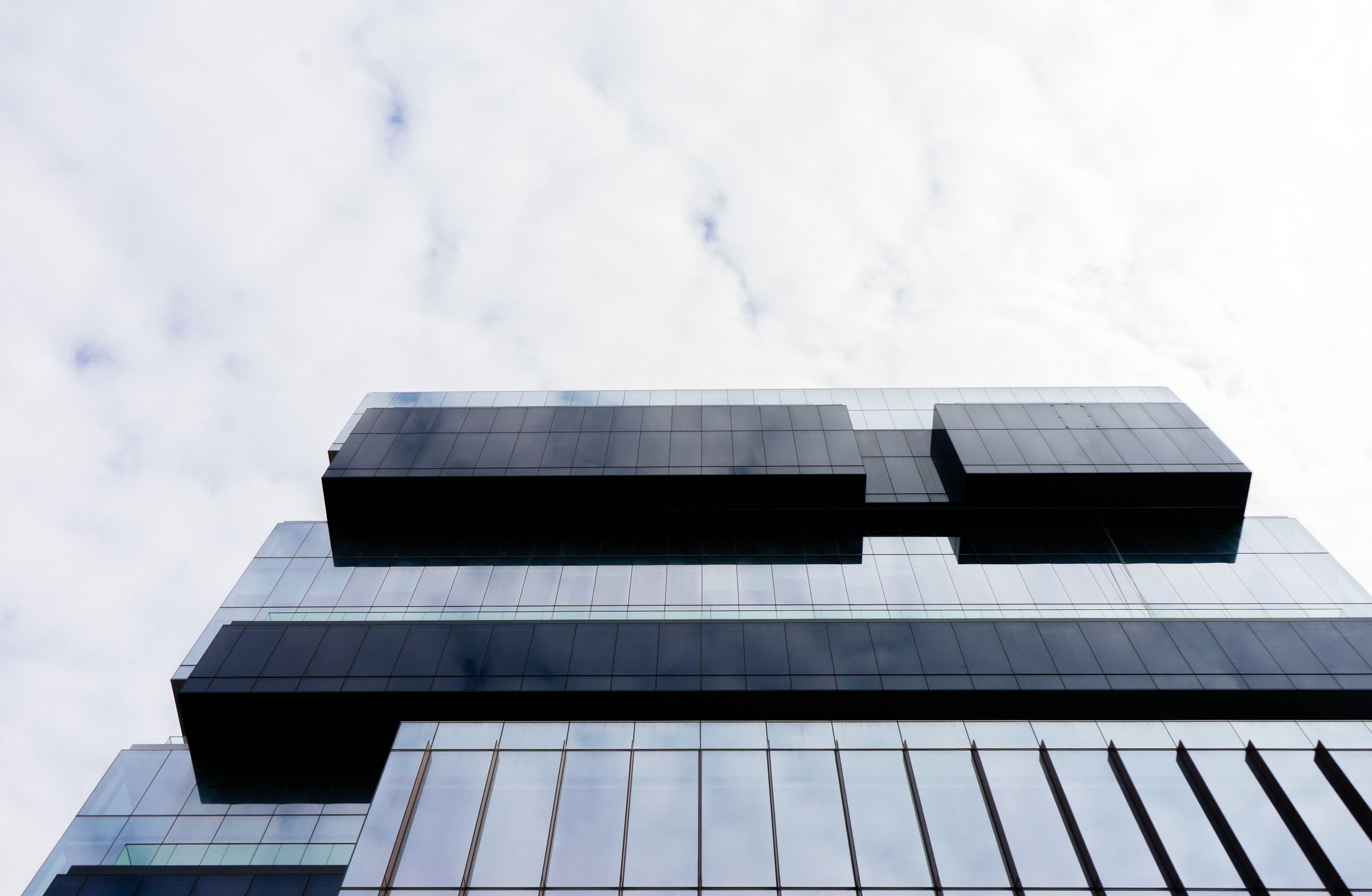 Modern glass building viewed from below